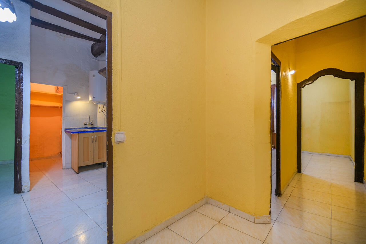 Interior before renovation — kitchen and hallway view